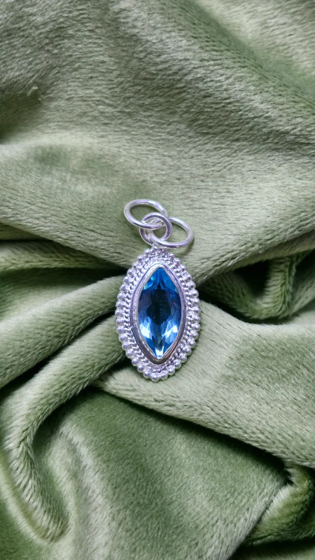 sterling silver handmade pendant with a marquise cut stone